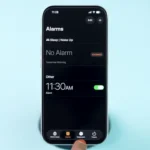 Open Settings on iPhone to adjust alarm volume.