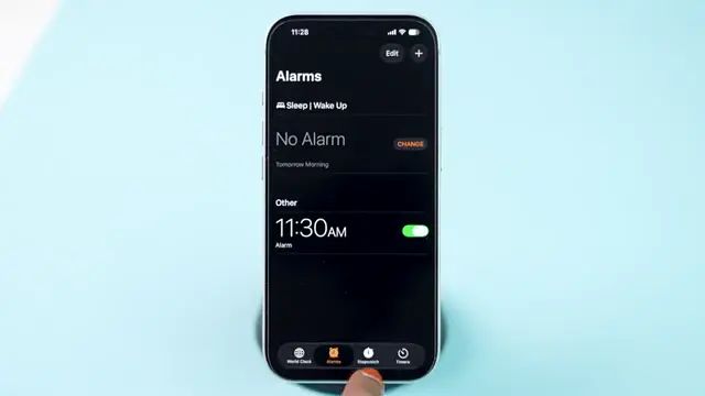 Open Settings on iPhone to adjust alarm volume.