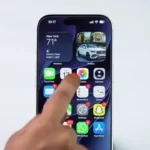 Opening a video in the Photos app on iPhone.
