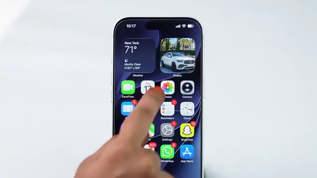Opening a video in the Photos app on iPhone.