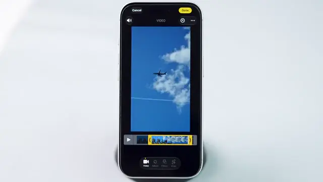 Saving the newly trimmed video on iPhone.